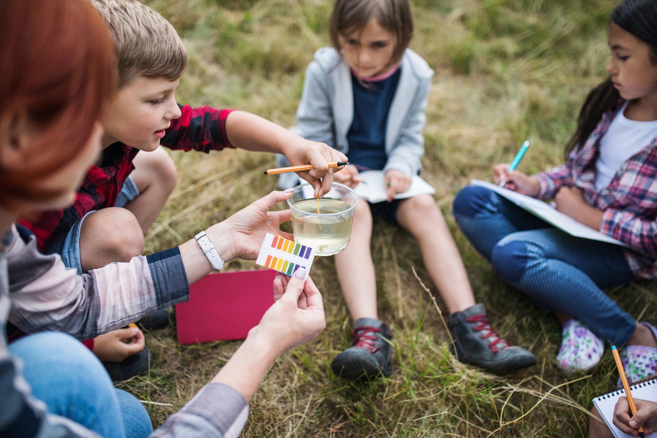 children learning outdoors hands-on education