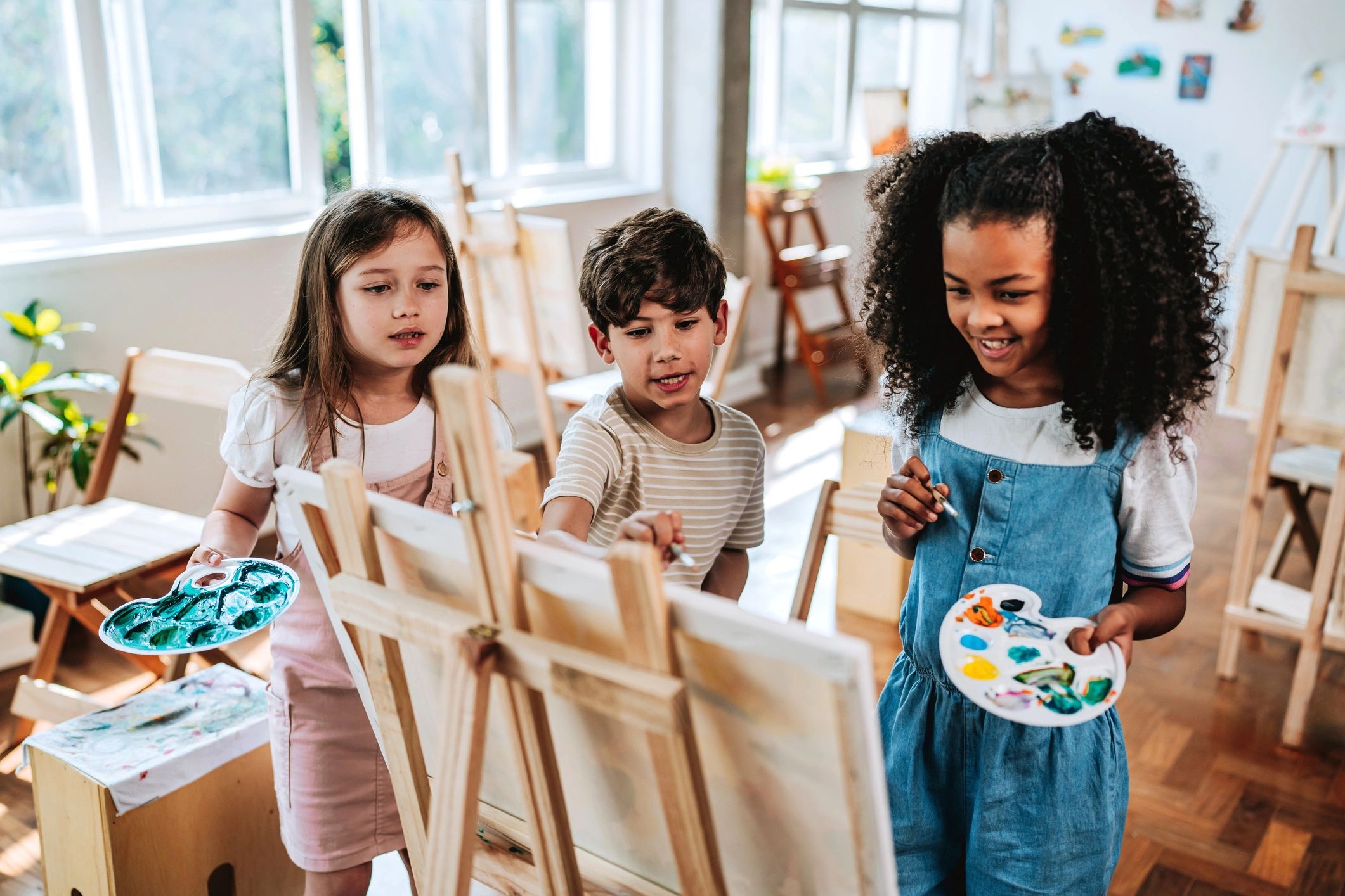 children engaged in creative arts learning